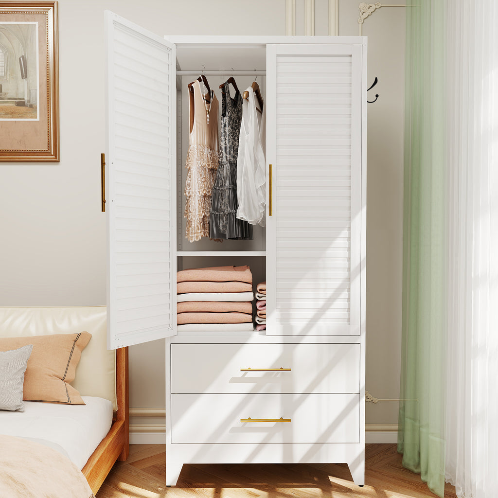 Louvered Wardrobe 71 in a bedroom with the doors open, clothes on the rod and folded sweaters on the shelf