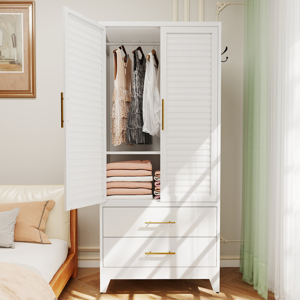 Louvered Wardrobe 71 in a bedroom with the doors open, clothes on the rod and folded sweaters on the shelf