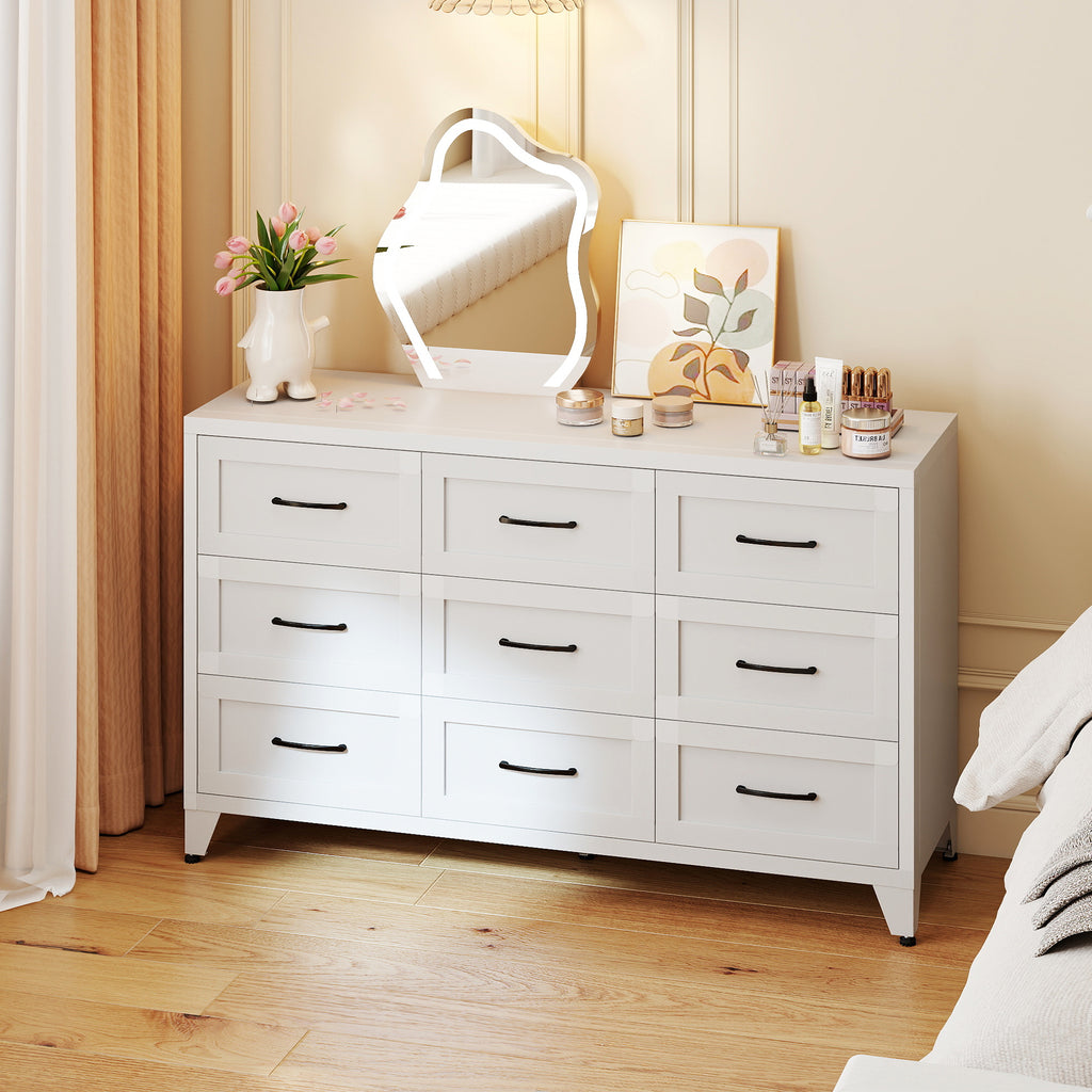 9-Drawer Dresser in Chalk in a bedroom, with a mirror and flowers on top