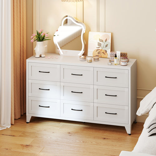 9-Drawer Dresser in Chalk in a bedroom, with a mirror and flowers on top