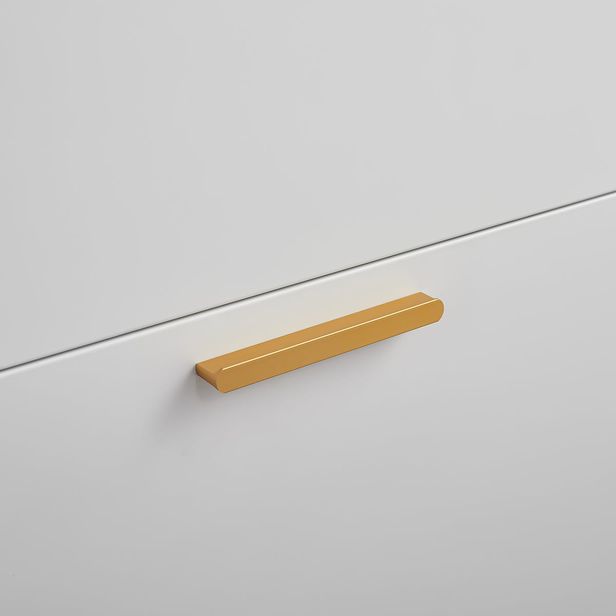 Close-up of the gold-tone bar handle on Slim Shoe Cabinet 48