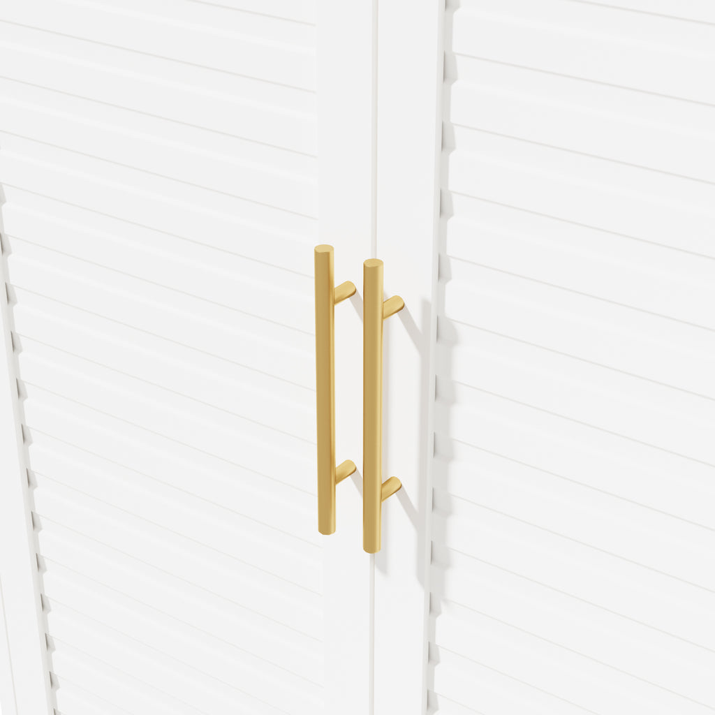 Close-up of the gold-tone bar handles on the louvered doors