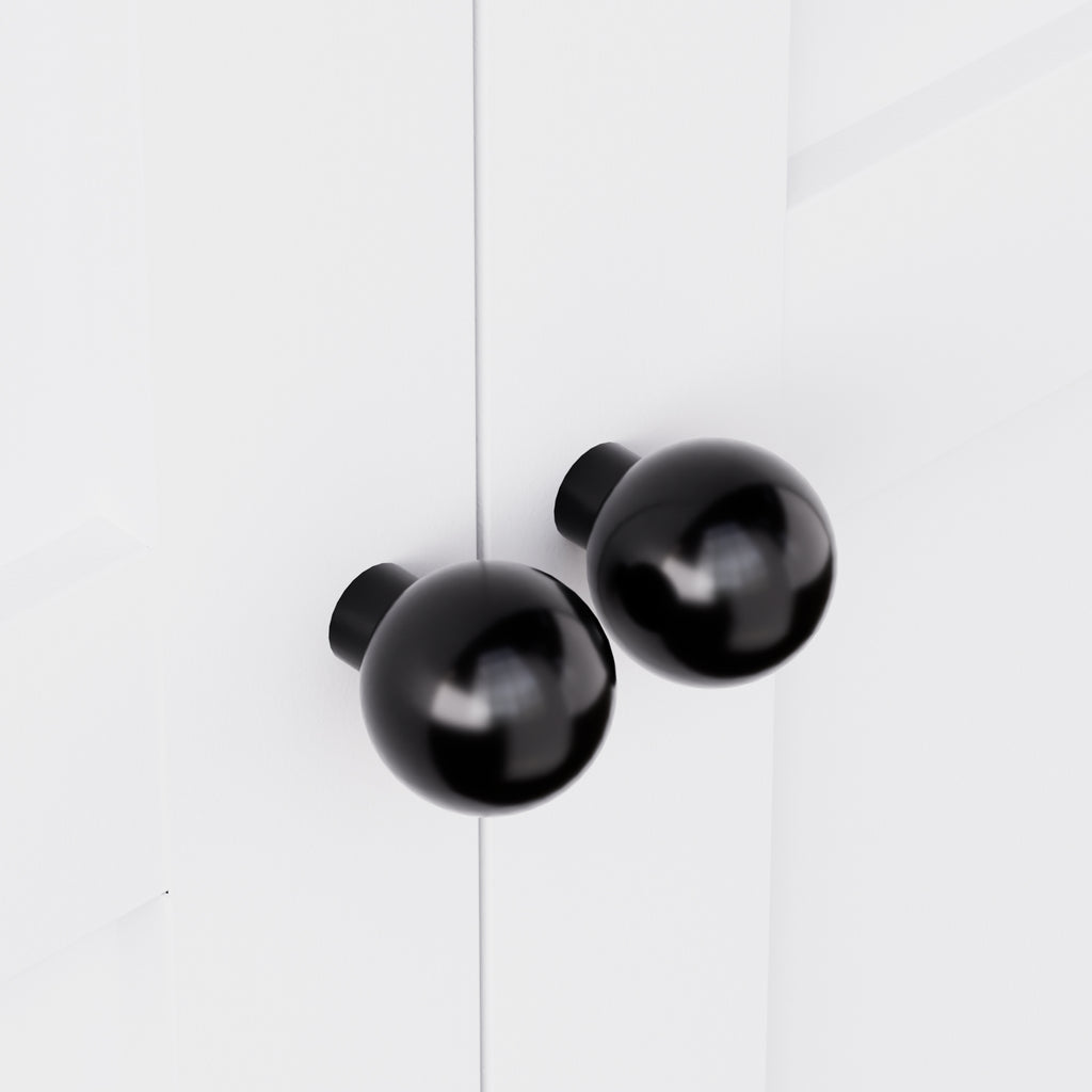 Close-up of the black round knobs on Pantry Hutch 72 in Chalk